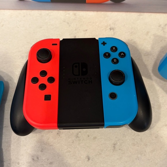 Nintendo Switch Console with Vibrant Red and Blue Controllers - Picture 6 of 8